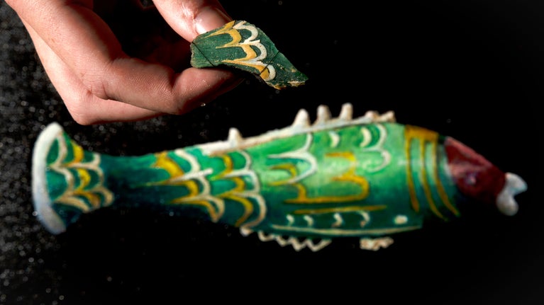 Fragment of glass from a fish shaped perfume bottle